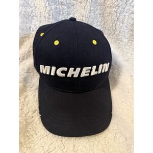 navy blue Michelin branded baseball cap with a yellow button and eyelets.